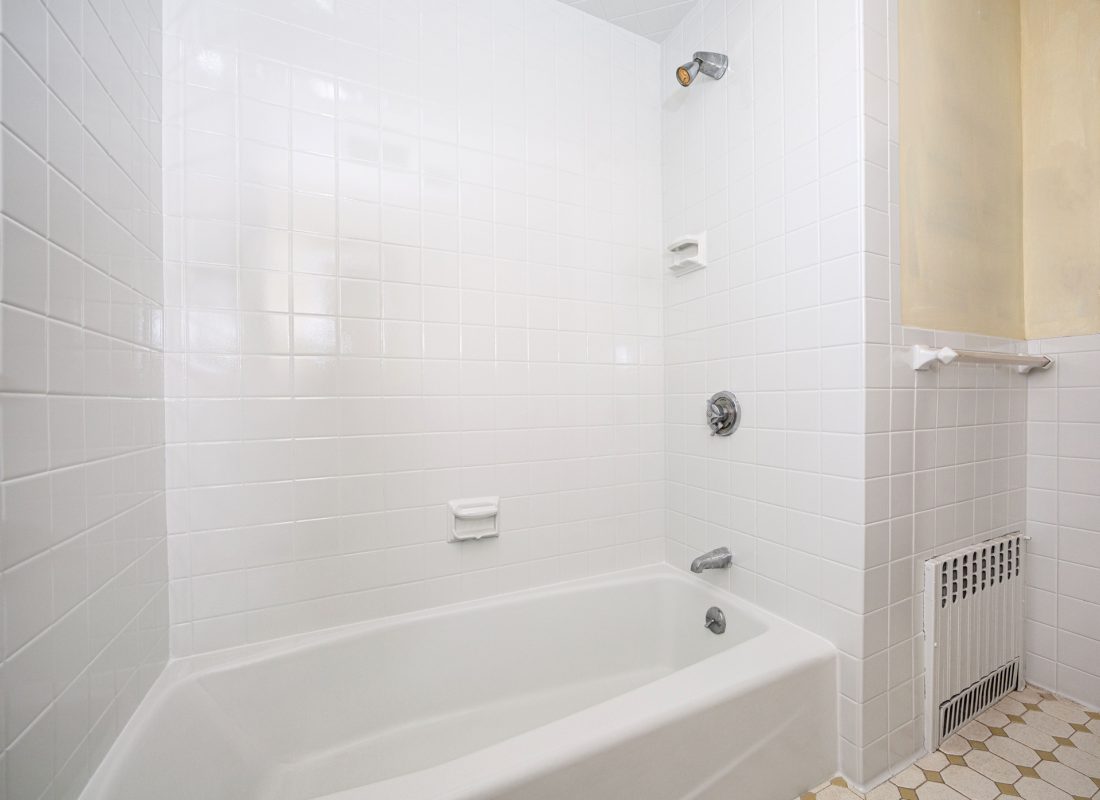 The transformation process of a bathtub in Boston by the skilled team at Porcelain Patch & Glaze